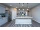 Well-lit kitchen with updated appliances, ample cabinet space, and a functional center island at 9723 Flooded Field Dr, Ladson, SC 29456