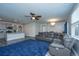 Bright living space with modern gray walls, sleek floors, and a comfortable sectional sofa at 9723 Flooded Field Dr, Ladson, SC 29456