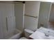 A bathroom featuring a vanity, toilet, mirror, and a shower/tub combination with white tile surround at 102 Dandelion St, Summerville, SC 29483