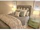 Cozy bedroom features decorative pillows and lamps, providing soft lighting, and creating a relaxing ambiance at 102 Dandelion St, Summerville, SC 29483