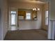 Open dining room with classic chandelier, and connection to kitchen with light wood cabinets at 102 Dandelion St, Summerville, SC 29483
