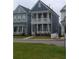 Charming two-story home with a double porch, perfect for enjoying outdoor living at 102 Dandelion St, Summerville, SC 29483