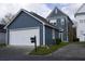 Charming two-story home with a two car garage, blue siding, and well-maintained landscaping at 102 Dandelion St, Summerville, SC 29483