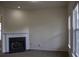Cozy living room featuring classic fireplace, carpeted floors, and bright natural lighting at 102 Dandelion St, Summerville, SC 29483