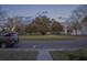 Neighborhood street with mature trees and well-maintained homes creating a peaceful atmosphere at 102 Dandelion St, Summerville, SC 29483