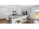 Well-appointed kitchen with granite countertops, stainless steel appliances, and a breakfast bar at 1027 Swamp Rose Run, Summerville, SC 29485