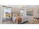 Serene primary bedroom featuring soft lighting, a neutral color palette, and plush bedding at 1027 Swamp Rose Run, Summerville, SC 29485