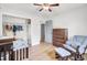 Cozy bedroom features hardwood floors, rocking chair, open closet, and dresser with lots of storage at 103 Arbor Rd, Summerville, SC 29485
