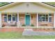 Inviting front porch with a charming swing, decorative plants, and warm curb appeal at 103 Arbor Rd, Summerville, SC 29485