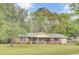 Charming brick home with blue shutters, manicured lawn, covered porch, and inviting curb appeal at 103 Arbor Rd, Summerville, SC 29485