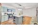 Bright kitchen features stainless appliances, an island, and sleek pendant lighting at 103 Arbor Rd, Summerville, SC 29485