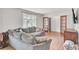 Comfortable living room with ample seating, wood-look floors, and natural light at 103 Arbor Rd, Summerville, SC 29485