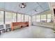 Spacious sunroom with great natural light, ceiling fans, concrete floor, and access to backyard at 103 Arbor Rd, Summerville, SC 29485