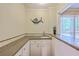 Stylish bar area with granite counters, sink, and views to the backyard at 104 Huckleberry Ln, Summerville, SC 29485