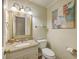 Classic bathroom with granite vanity, framed mirror, and decorative lighting at 104 Huckleberry Ln, Summerville, SC 29485