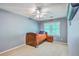 Bedroom featuring a fan, window, and a cozy bed with natural light at 104 Huckleberry Ln, Summerville, SC 29485