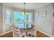 Cozy dining nook with a round wood table, natural light, and view to the outside at 104 Huckleberry Ln, Summerville, SC 29485
