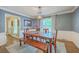 Stylish dining room with wood table and chairs, complemented by a cozy rug and soft lighting at 104 Huckleberry Ln, Summerville, SC 29485