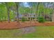 Beautiful two-story home with mature trees, brick facade, and lush landscaping in a desirable neighborhood at 104 Huckleberry Ln, Summerville, SC 29485