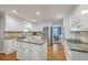 A spacious kitchen is equipped with modern appliances, ample counter space, and an island for cooking at 104 Huckleberry Ln, Summerville, SC 29485