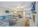 Bright living room featuring fireplace, large sectional, and seamless flow into other spaces at 104 Huckleberry Ln, Summerville, SC 29485