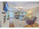Comfortable living room with fireplace, large sectional sofa, and access to outdoor area at 104 Huckleberry Ln, Summerville, SC 29485