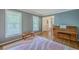 Inviting living room with hardwood floors, large windows, and a piano for entertainment at 104 Huckleberry Ln, Summerville, SC 29485