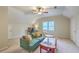 Cozy living room featuring plush green sofa, desk area, and modern decor at 104 Huckleberry Ln, Summerville, SC 29485