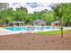 Community pool with ample seating, pristine blue water, and a nearby gazebo for relaxation and recreation at 104 Huckleberry Ln, Summerville, SC 29485