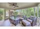 Relaxing screened porch with ceiling fan and comfortable seating area at 104 Huckleberry Ln, Summerville, SC 29485