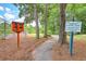 Leisure trail with a 'Little Free Library' for residents to enjoy, enhancing community and outdoor living at 104 Huckleberry Ln, Summerville, SC 29485