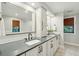 Elegant bathroom with double vanity sinks, quartz countertops, and modern black fixtures at 1056 Wharf Indigo Pl, Mount Pleasant, SC 29464