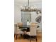 Lovely dining room with round table, seating, and light fixture at 1056 Wharf Indigo Pl, Mount Pleasant, SC 29464