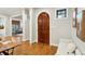Elegant foyer with rich hardwood floors, stylish decor, and inviting archway to living spaces at 1056 Wharf Indigo Pl, Mount Pleasant, SC 29464