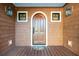 Wood door with handle and windows and lanterns. Nice porch with decking boards at 1056 Wharf Indigo Pl, Mount Pleasant, SC 29464