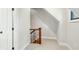 Hallway with a decorative wood and wrought iron railing, leading to the upper level at 1056 Wharf Indigo Pl, Mount Pleasant, SC 29464