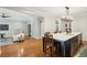 Open concept kitchen with an island and a view into the adjacent living room at 1056 Wharf Indigo Pl, Mount Pleasant, SC 29464