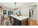 Open kitchen with large island and stainless steel appliances with hardwood floors at 1056 Wharf Indigo Pl, Mount Pleasant, SC 29464