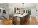 Gourmet kitchen with stainless steel appliances, large island, and sleek countertops at 1056 Wharf Indigo Pl, Mount Pleasant, SC 29464