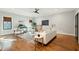 Bright living room featuring hardwood floors, neutral colors, and a stylish ceiling fan at 1056 Wharf Indigo Pl, Mount Pleasant, SC 29464
