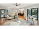 Comfortable living room featuring hardwood floors, natural light, and modern furnishings at 1056 Wharf Indigo Pl, Mount Pleasant, SC 29464