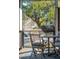 Inviting screened porch with a wooden table, chairs, and a view of the surrounding landscape and a small lake at 1056 Wharf Indigo Pl, Mount Pleasant, SC 29464