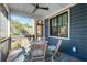 Relaxing screened porch with a round table, chairs, and a ceiling fan, perfect for outdoor enjoyment at 1056 Wharf Indigo Pl, Mount Pleasant, SC 29464