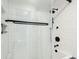 All white tile shower with glass enclosure and modern rainfall shower head with dark hardware at 1056 Wharf Indigo Pl, Mount Pleasant, SC 29464