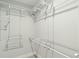 Well-organized walk-in closet featuring ample shelving and storage for clothing and accessories at 1056 Wharf Indigo Pl, Mount Pleasant, SC 29464