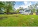Large, fully fenced yard showcases a charming two-story house and is ideal for outdoor gatherings at 106 Dunmow Dr, Summerville, SC 29485