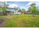 Spacious backyard with ample lawn and a view of the home's rear elevation at 106 Dunmow Dr, Summerville, SC 29485