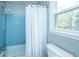 Bathroom featuring a shower, white curtain, and window for natural light at 106 Dunmow Dr, Summerville, SC 29485