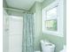 Bathroom with shower and green walls featuring a window that provides natural light at 106 Dunmow Dr, Summerville, SC 29485