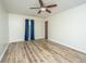 Spacious bedroom features wood floor, ceiling fan, and a large window at 106 Dunmow Dr, Summerville, SC 29485